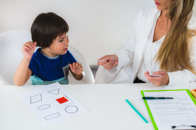 Young boy and therapist doing assessment